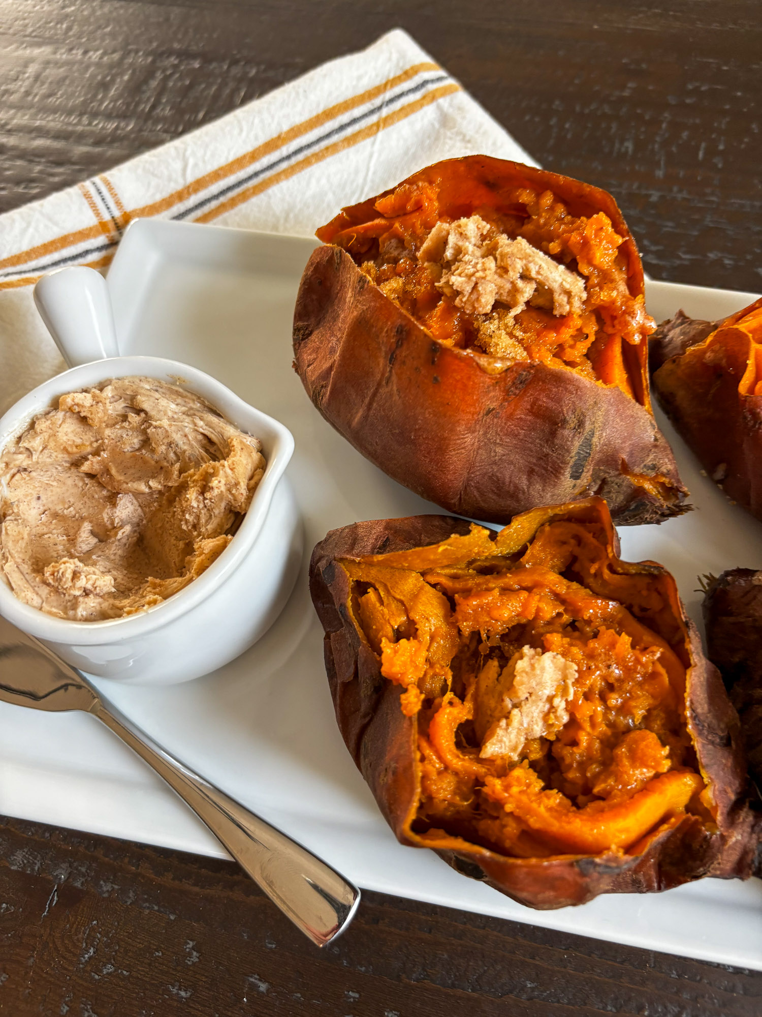 Baked sweet potatoes topped with crispy crumbs, served with cinnamon butter