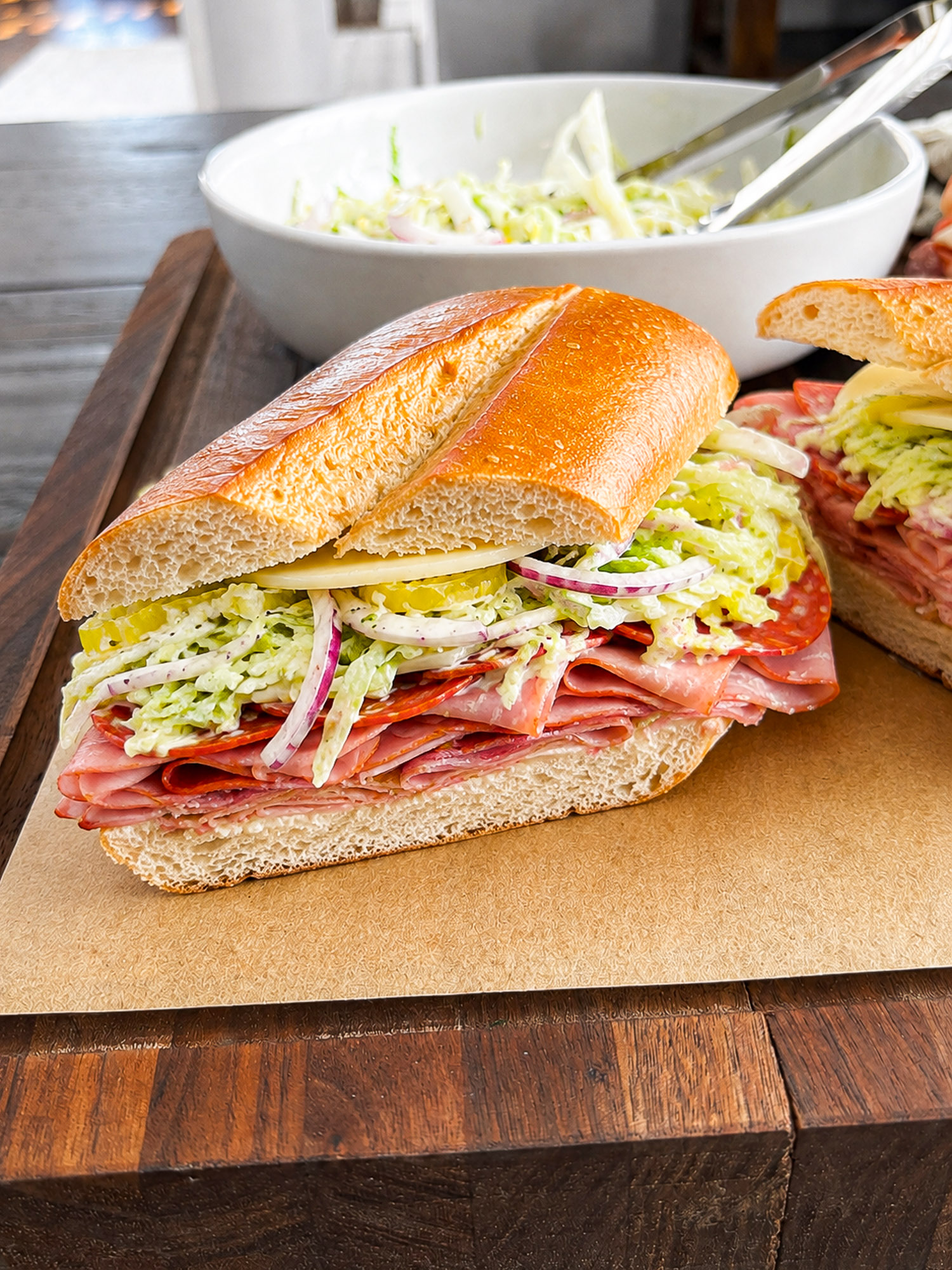 Italian Grinder Sandwich with Creamy Deli Slaw 3 Italian sub sandwich with meats, cheese, lettuce, tomatoes, and onions